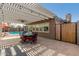 Beautiful outdoor patio area featuring a dining set, shade structure, and views of the inviting backyard pool at 5401 N 81St Pl, Scottsdale, AZ 85250