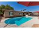 Private backyard pool area, perfect for relaxation and entertainment, surrounded by lush greenery and a covered patio at 5401 N 81St Pl, Scottsdale, AZ 85250