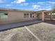 Spacious backyard features a covered patio and an expansive area ready for landscaping at 5822 W Huntington Dr, Laveen, AZ 85339