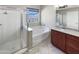 Bathroom featuring shower, soaking tub, and double sink vanity at 5822 W Huntington Dr, Laveen, AZ 85339