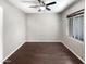 This is an interior shot of the bedroom with a window and ceiling fan at 5822 W Huntington Dr, Laveen, AZ 85339