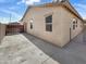 The house shows a fenced yard and a concrete slab for low-maintenance landscaping at 5822 W Huntington Dr, Laveen, AZ 85339