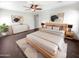 Comfortable main bedroom featuring a ceiling fan, neutral decor, and ample natural light at 5822 W Huntington Dr, Laveen, AZ 85339