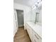 Bright bathroom with white vanity, quartz counters, white cabinets, and walk-in shower at 60 W Shamrock St, Gilbert, AZ 85233