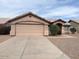 Single-story house featuring a two-car garage, desert landscaping and a neutral color scheme at 60 W Shamrock St, Gilbert, AZ 85233