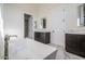 Luxurious bathroom with a freestanding tub, dual vanities, and stylish marble floors at 6378 S 154Th St, Gilbert, AZ 85298