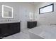 Bright bathroom featuring dual vanities, a modern soaking tub, and sleek, marble flooring at 6378 S 154Th St, Gilbert, AZ 85298