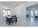 Dining room featuring a table with seating for six and modern light fixture at 6378 S 154Th St, Gilbert, AZ 85298