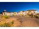 Luxury home at night, with patterned brick driveway and desert landscaping at 6378 S 154Th St, Gilbert, AZ 85298