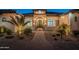 Inviting front entrance of a luxury home with brick pathway and manicured landscaping at 6378 S 154Th St, Gilbert, AZ 85298