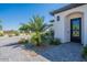 Exterior front view of the house with desert landscaping and a stone paver walkway at 6378 S 154Th St, Gilbert, AZ 85298