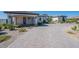 Long driveway leads to front of luxury home with desert landscaping and white facade at 6378 S 154Th St, Gilbert, AZ 85298