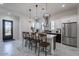 Spacious kitchen with stainless steel appliances, quartz countertops, and pendant lighting at 6378 S 154Th St, Gilbert, AZ 85298