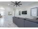 Comfortable living room view, including a couch and marble-style flooring at 6378 S 154Th St, Gilbert, AZ 85298