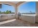 Covered outdoor kitchen featuring stainless steel sink, built-in grill, and marble countertops at 6378 S 154Th St, Gilbert, AZ 85298