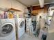 This laundry area has both washer and dryer hookups and a utility sink at 652 S Ellsworth Rd # 46, Mesa, AZ 85208