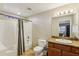 Well-lit bathroom featuring a shower-tub combo, toilet, and vanity with granite countertops at 7609 E Indian Bend Rd # 2008, Scottsdale, AZ 85250