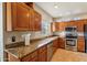 Well-equipped kitchen featuring granite countertops and stainless steel appliances at 7609 E Indian Bend Rd # 2008, Scottsdale, AZ 85250