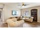 Bright living room featuring a ceiling fan and wall-mounted TV at 7609 E Indian Bend Rd # 2008, Scottsdale, AZ 85250