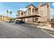 Exterior of condo buildings featuring covered parking spaces, desert landscaping and neutral-toned color palette at 7609 E Indian Bend Rd # 2008, Scottsdale, AZ 85250