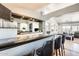 Modern wet bar with barstool seating overlooking the Gathering room at 7712 N 54Th Ln, Glendale, AZ 85301