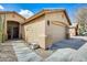 Well-maintained home featuring a two-car garage and desert-friendly landscaping at 7712 N 54Th Ln, Glendale, AZ 85301