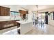 Bright kitchen featuring stainless steel appliances, an island, and an adjacent dining area at 7712 N 54Th Ln, Glendale, AZ 85301