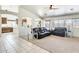 Bright living room featuring neutral carpet, large windows, and contemporary furniture at 7712 N 54Th Ln, Glendale, AZ 85301