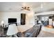 Spacious living room with ceiling fan, tile floors, and neutral color palette at 7712 N 54Th Ln, Glendale, AZ 85301