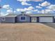 Charming single-story home with a gravel yard, white garage door, and inviting double-door entrance at 776 S Saguaro Dr, Apache Junction, AZ 85120