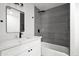 Modern bathroom featuring a vanity with white countertop and sleek fixtures and tiled shower with glass enclosure at 8525 E Clarendon Ave, Scottsdale, AZ 85251