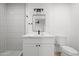 Modern bathroom featuring a framed mirror, stylish lighting, and a shower with subway tile at 8525 E Clarendon Ave, Scottsdale, AZ 85251