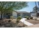 Charming home featuring desert landscaping and a walkway leading to the front entrance at 8525 E Clarendon Ave, Scottsdale, AZ 85251