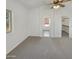 Bright bedroom featuring carpet, ceiling fan and windows allowing natural light at 8722 W Wilshire Dr, Phoenix, AZ 85037