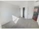 Bedroom with carpeted floor and access to a closet at 8722 W Wilshire Dr, Phoenix, AZ 85037