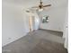 Bright bedroom featuring carpet, ceiling fan and windows allowing natural light at 8722 W Wilshire Dr, Phoenix, AZ 85037