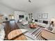 Bright living room with wood floors, a white sofa, and a large window at 8722 W Wilshire Dr, Phoenix, AZ 85037