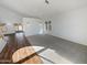 Spacious living room featuring a combination of hardwood floors and carpeted areas at 8722 W Wilshire Dr, Phoenix, AZ 85037