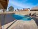 Backyard pool with a concrete deck and a surrounding block fence at 8722 W Wilshire Dr, Phoenix, AZ 85037