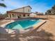 Backyard view of refreshing pool and house at 8722 W Wilshire Dr, Phoenix, AZ 85037