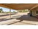 Covered patio in a backyard with a grill, and gravel landscaping at 902 S Saranac Ave, Mesa, AZ 85208