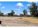 Wide view of the community showcasing well-maintained grounds, mature trees, and Arizona landscaping at 902 S Saranac Ave, Mesa, AZ 85208