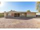 Charming single-story home with gravel front yard and attached two-car garage at 902 S Saranac Ave, Mesa, AZ 85208