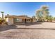 Spacious single-story home with gravel landscaping, a covered porch, and an attached garage at 902 S Saranac Ave, Mesa, AZ 85208