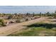 Lush green golf course stretching across the landscape, offering a scenic backdrop to the surrounding homes and community at 902 S Saranac Ave, Mesa, AZ 85208