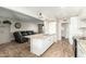 Modern kitchen with granite counters, stainless steel appliances, and an island with a sink at 902 S Saranac Ave, Mesa, AZ 85208