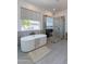 Spa-like main bathroom with a standalone tub, glass shower, and stylish decor at 11242 E Crescent Ave, Mesa, AZ 85208