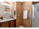 Bathroom with a pedestal sink, a shower and vanity with a mirror at 11411 N 91St Ave # 48, Peoria, AZ 85345