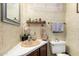 Bathroom featuring vintage patterned wallpaper, peach colored fixtures, and decorative accents at 11411 N 91St Ave # 48, Peoria, AZ 85345