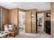 Bathroom with wood paneling and a view into a adjacent water closet at 11411 N 91St Ave # 48, Peoria, AZ 85345